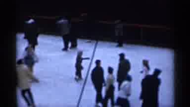 New York City (1955): A A Bunch Of People All Skiing Together In A Rink In A Park