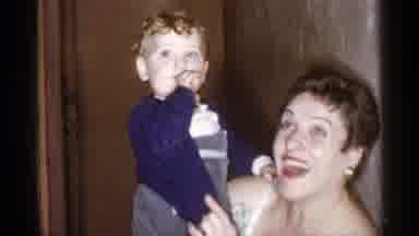 New York City (1955): An Adult Woman Holding Her Blond Baby On Her Lap