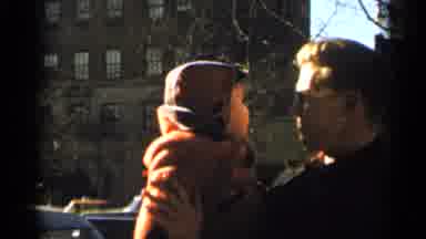 New York City (1955): Blonde Man With Sunglasses Trying To Cheer His Son With The