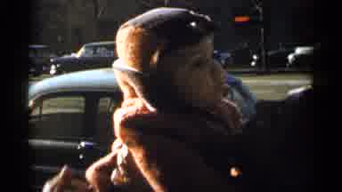 New York City (1955): Mom Holding A Baby Then Putting His In His Create
