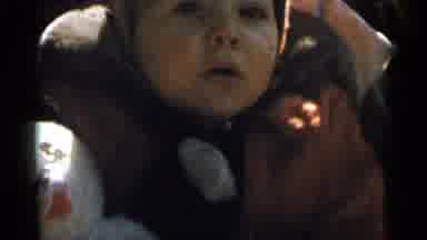 New York City (1955): A Baby Boy Is Bundled Up And Sitting In A Stroller With A