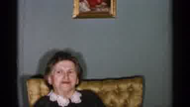 New York City (1955): Elderly Women Wearing Dress With White Collar Sitting In