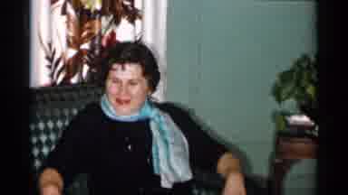 New York City (1955): A Woman Sitting On A Patterned Chair While Wearing A Black