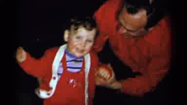 New York City (1955): A Man Tries To Get A Toddler To Smile And Face The Camera