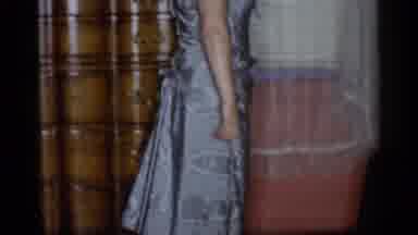 New York City (1955): A Woman Models A Formal Gown In A Room With Pink Walls And