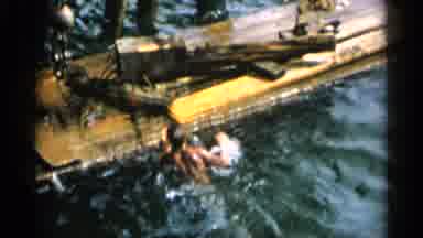 Cape Cod Massachusetts (1956): Human Is Swimming In The Sea And He See A Building
