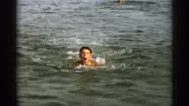 Cape Cod Massachusetts (1956): Man And Woman Swimming In Water On A Clear Sunny