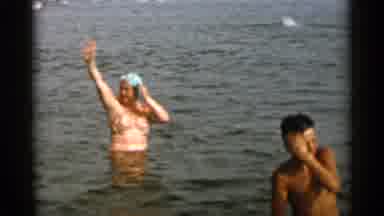 Cape Cod Massachusetts (1956): Woman In Bathing Suit And Cap Waving Young Boy