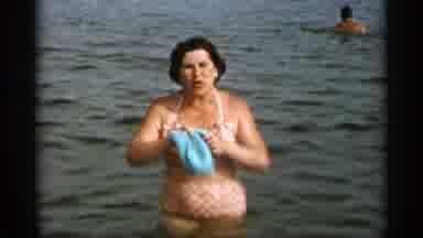 Cape Cod Massachusetts (1956): A Family Beach Day With A Woman Wading In Water And