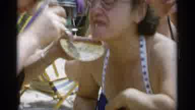 Jones Beach New York (1956): A Woman Being Shovel Fed Cake For Some Unknown Reason