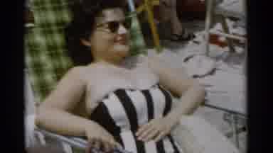 Jones Beach New York (1956): Man Wearing White Shirt Eats Drumstick On A Sunny Day