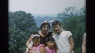 Jones Beach New York (1956): Large Family Embracing Kissing On A Beautiful Day For
