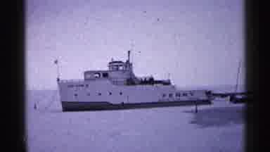 Duluth Minnesota (1960): A Ship Sitting In Place On The Frozen Ground Surrounded