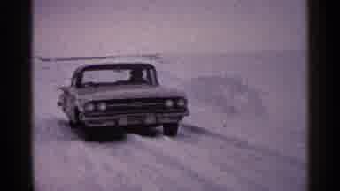 Duluth Minnesota (1960): White Car Stuck In Snow On A Clear Winter Day