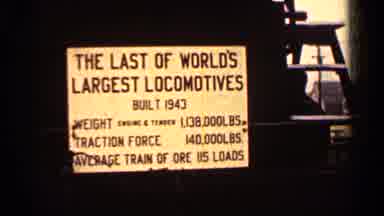 Duluth Minnesota (1960): A Giant Sign For The World's Largest Train On A Snowy Day