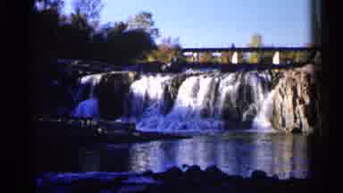 Sioux Falls South Dakota (1960): River With Falls Surrounded By Green Area And