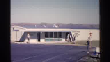Sioux Falls South Dakota (1960): People At The Entrance Of A Building Waiting For