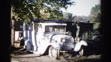 Sioux Falls South Dakota (1960): Light Blue Car And Person Riding Red Lawn Mower