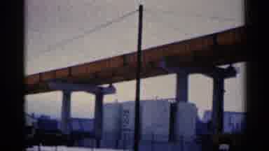 Duluth Minnesota (1961): Panning A Large Orange Bridge Spanning Across An