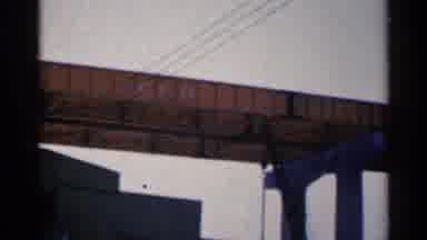Duluth Minnesota (1961): Bright Yellow Bridge And Wires On A Cloudy Day