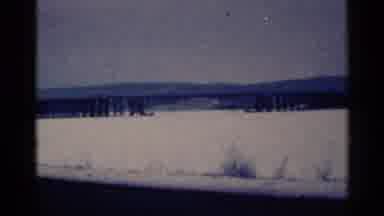 Duluth Minnesota (1961): Mountain Silhouette And Brown Wooden Posts On A Cloudy