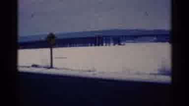 Duluth Minnesota (1961): Snowy Landscape With Road And Sign In Foreground And