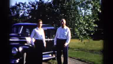 Duluth Minnesota (1961): Men Woman Car Tree Windy Wave Standing Talking Road Dress