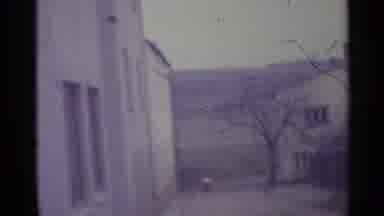 Spain (1961): Woman Carries Sticks In Yards Of White Houses