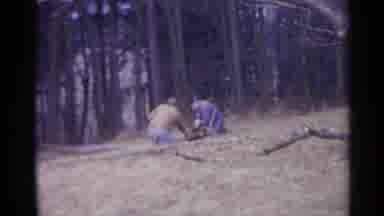 Spain (1961): Three Men Work With Lumber In The Forest Outside While Children Play