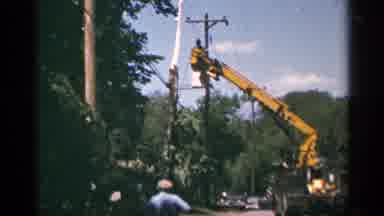 Minnesota USA (1964): Man Fixing A Power Generator Attached To An Electric Pole On