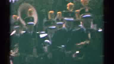 Minnesota USA (1964): A Military Band In Dark Clothes Marching While Playing Some