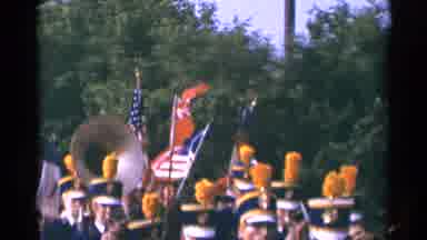 Minnesota USA (1964): A Band With Yellow Plumes Marches With Their Instruments And