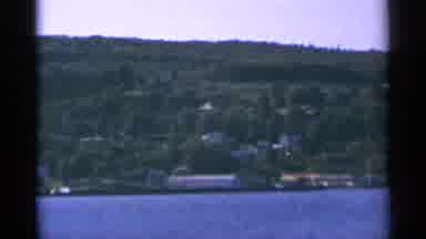 Minnesota USA (1964): Multiple Houses On A Tree Covered Hillside On A Sunny Day