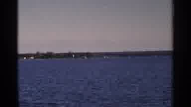 Minnesota USA (1964): A Man Stands At The Edge Of A Chained Railing On A Boat