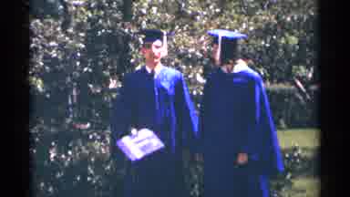 Minnesota USA-1964: Young Man And Woman In Blue Graduation Gowns Holding Diplomas