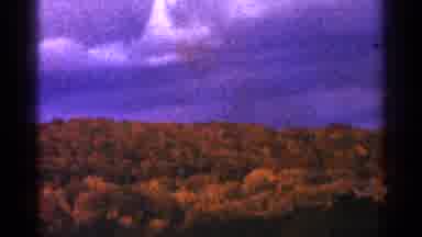 Minnesota USA (1964): Big Mountain With Sky Over It And Mountain Covered In Trees