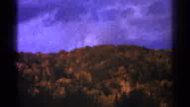 Minnesota USA (1964): Mountains Covered In Grass And Trees With Sky Over It
