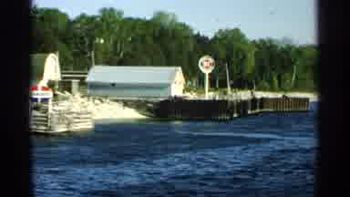 Washington Island Wisconsin (1964): Person Riding Bike Along Edge Of Lake Past