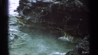 Washington Island Wisconsin (1964): Water Splashes Up Against A Rocky Shore As A