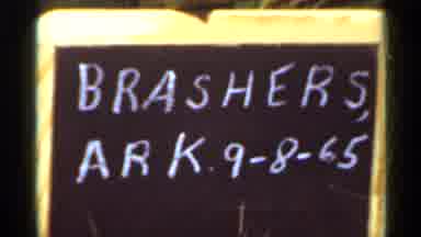 Arkansas USA (1965): Black And Yellow Chalkboard Sign And Haystacks On A Sunny Day