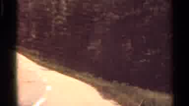 Arkansas USA (1965): Traveling Down A 2 Lane Road With An Asphalt Patch