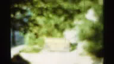 Arkansas USA (1965): Fountain In Roadway In Sunshine With Blurry Background Of