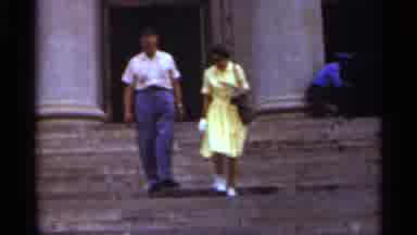 Arkansas USA (1965): Man And Woman Outside Large Building With Columns Walking