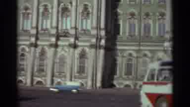 LENNINGRAD RUSSIA-1965: Woman Standing By Soviet Warship With Red Flag