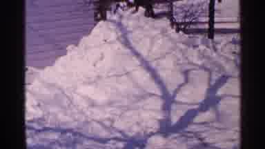 Minnesota USA (1965): Shadow Of A Tree Over A Pile Of Snow Next To A House With A