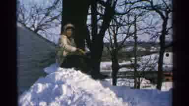 Minnesota USA (1965): Man Throwing Snowball In Winter Weather Walking On Snow Near