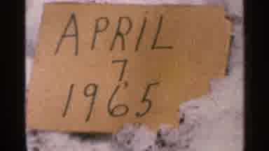 Minnesota USA (1965): Cardboard Sign In Snow With The Words April 7 1965 Written