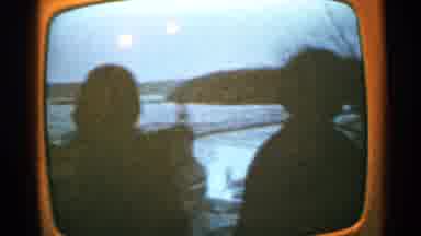Minnesota USA (1965): Two People Who Are Sitting Together Watching The Sunset