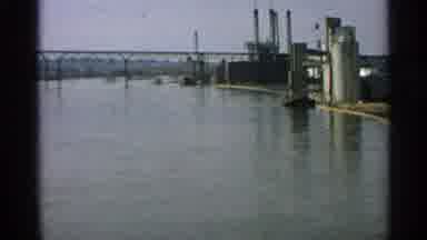 Minnesota USA (1965): River Water Is At High Tide Near And Industrial Site With A