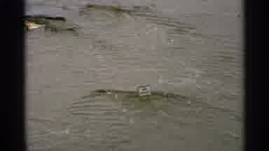 Minnesota USA (1965): A A Bunch Of Trash Flowing Up The River And Then A Wider
